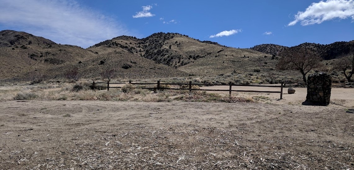 Photo of eastern mountains near a park with worn wildlife fense