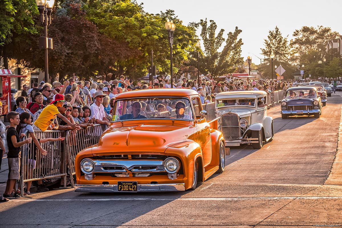 Classic cars driving down victorian square