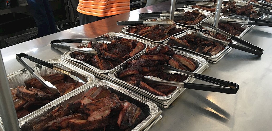 Multiple racks of ribs on a table